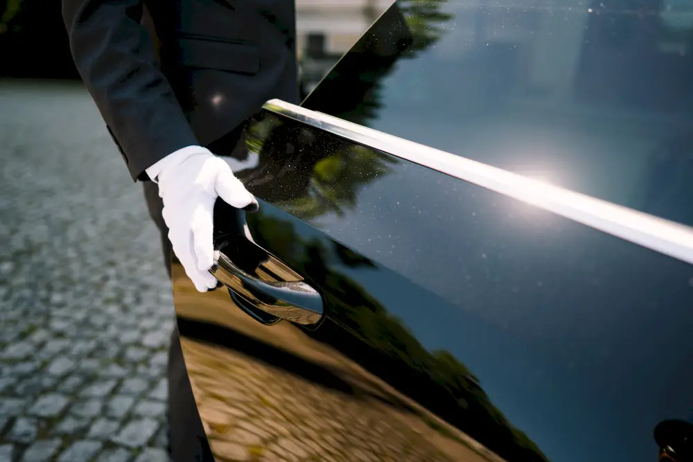 photo of a driver opening the car door